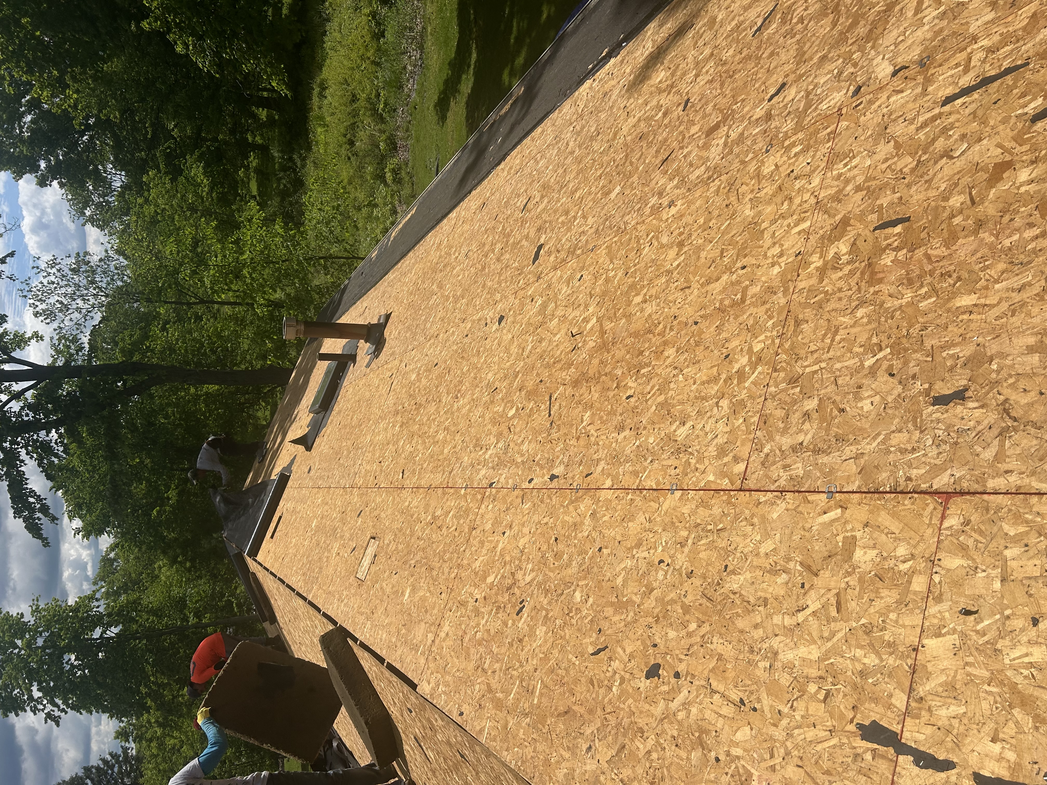 Fresh plywood roof decking installed and ready for underlayment